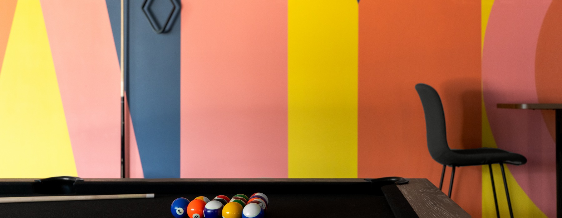 pool table against bright colored wall